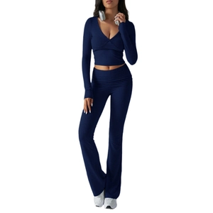 Navy blue women's two-piece athletic set with V-neck long sleeve top and high waist pants