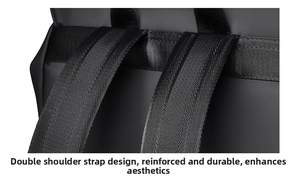 Detailed close-up of reinforced nylon shoulder straps on a durable black business backpack