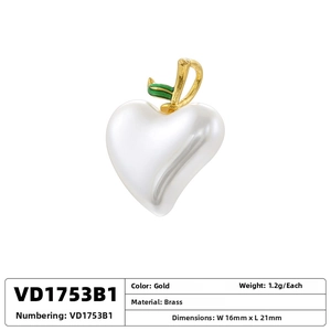 Detailed close-up of heart-shaped pearl pendant with gold stem and green enamel leaf