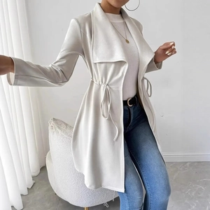 Close-up of beige drawstring waist coat with lapel collar and soft suede texture