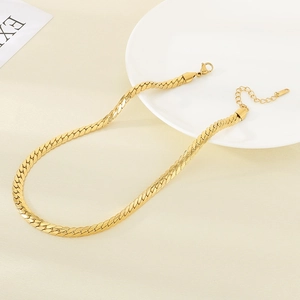 Detailed close-up of 18K gold plated flat snake chain necklace with lobster clasp