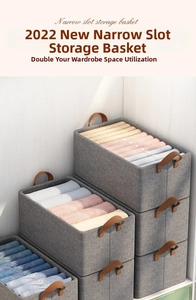 Stackable grey fabric storage bins with leather handles for closet organization