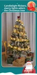 Detail of gold mesh Christmas ribbon with warm LED stars on a snow-covered tree