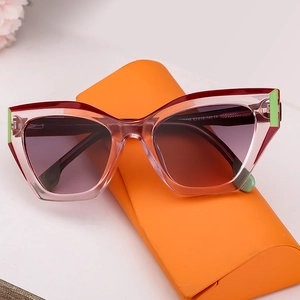 Fashionable cat-eye sunglasses with pink resin frames and geometric hollow design