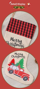 Detail of Christmas stocking with gnome and red truck print on beige linen fabric