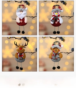 Detail showing plush Christmas hanging ornaments with red plaid fabric and long beaded legs