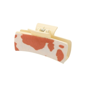 Cow pattern hair claw clip in beige and reddish-brown with premium leather texture