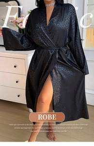 Detail of black leopard print satin robe with kimono sleeves and matching waist tie