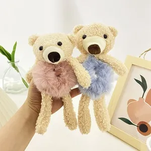 Close-up of cute pink and blue plush bear hair ties made of soft faux fur and lamb wool