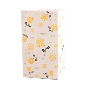 Cartoon style floral gift bag in cream with yellow flower patterns for children birthdays