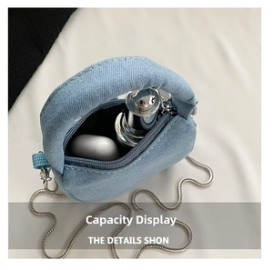 Internal view of light blue denim mini bag showing storage capacity for small essentials
