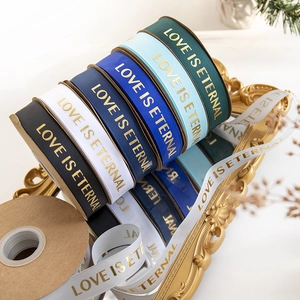 2.5cm gold-stamped ribbed ribbons with Love Is Eternal text for flower bouquet wrapping