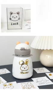 Close-up of shiny laser cartoon stickers on water bottles and acrylic organizers