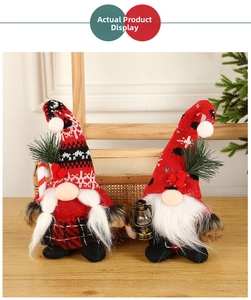 Close-up of knit Christmas gnomes featuring plush beards, a lantern, and candy cane props