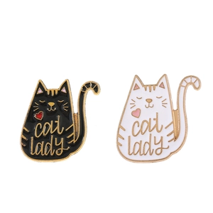 Set of two cute cat lady enamel pins in black and white with gold metal accents