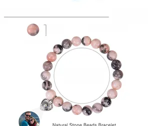 Detail showing 8mm pink zebra stone beads and heart photo projection charm bracelet