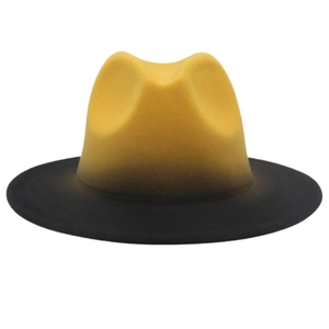 Detail of the yellow and black gradient felt fedora hat with wide brim design