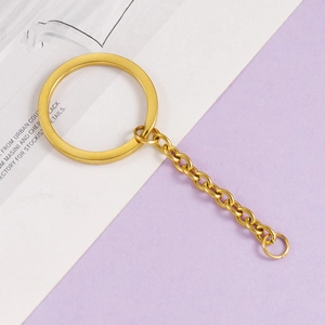 Close-up of golden stainless steel flat key ring with chain links and jump ring detail