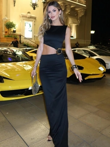 Elegant black sleeveless cutout dress with gold metal ring detail for evening parties