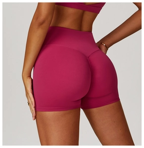 Close-up of magenta yoga shorts featuring high waist and V-shaped seam for butt-lifting
