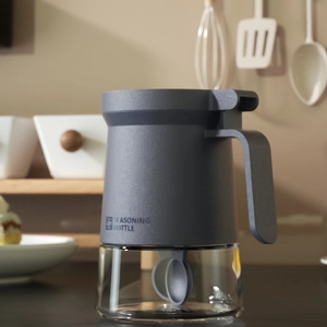 Airtight dark gray glass seasoning jar with integrated spoon and moisture-proof seal