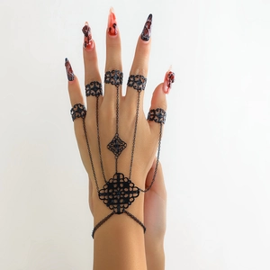 Gothic black jointed finger ring bracelet featuring hollow metal and filigree texture