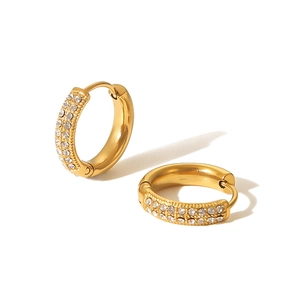 Detail of 18k gold plated huggie earrings with double rows of sparkling cubic zirconia
