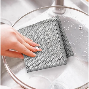 Gray wire dishcloth for kitchen cleaning, scrubbing glass lids in the sink