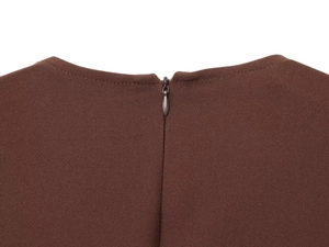 Macro shot of invisible back zipper on dark brown crepe fabric with fine texture