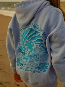 Detail of 3D puff print lettering on the back of a light blue oversized hoodie