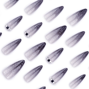 Black gradient long stiletto press-on nails with silver glitter and rhinestone accents