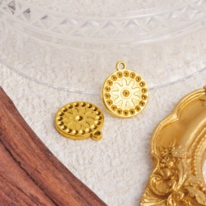 Minimalist gold 304 stainless steel round pendant featuring embossed sunflower design