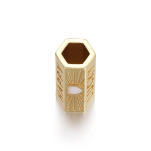 Close-up of gold hexagonal pendant featuring HAPPY and LUCKY engravings and sunburst motif