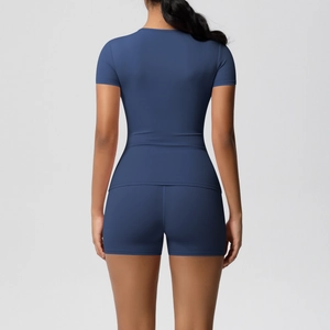 Rear view of navy blue elastic yoga set showing high-waisted shorts and slim-fit t-shirt