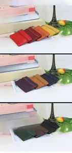 Macro shot of multi-color genuine leather wallets with front zippers and layered compartments