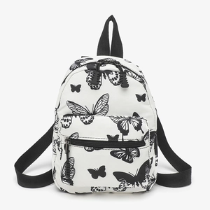 Fashionable mini canvas backpack with butterfly print and front pocket for casual use
