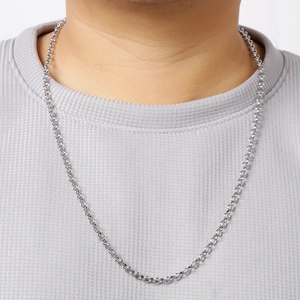 Silver stainless steel bead chain necklace worn by a model against a neutral background
