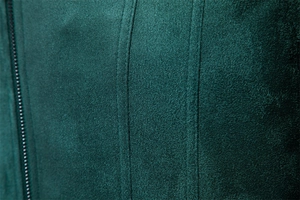 Close-up of high-quality dark green faux suede jacket fabric with precise double stitching