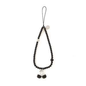 Handmade phone charm with black beads and a cherry pendant on a white background