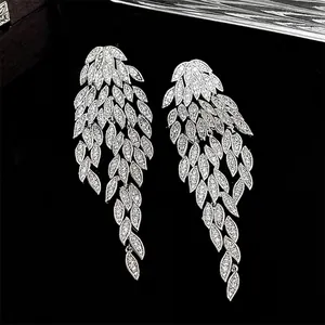 Elegant silver feather tassel earrings with sparkling zircon stones for evening wear