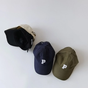 Top view of flat lay cotton baseball caps in navy, olive, beige, and black with P embroidery