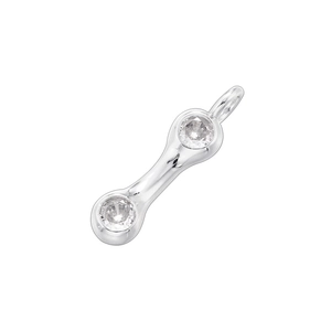 Detailed macro of a silver-toned bamboo style pendant with clear round-cut gemstones