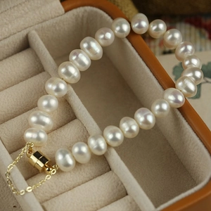 Vintage irregular freshwater pearl bracelet with gold hardware in cream jewelry box
