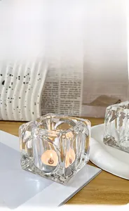 Detailed close-up of textured ice-cube glass candle holder with aesthetic ripple effect