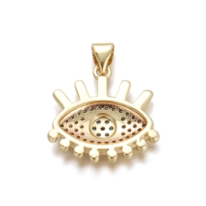 Detailed view of a gold-plated evil eye charm with blue and clear zircon stones