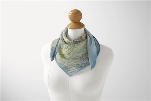 Detail of a 53cm silk scarf with oil painting pattern tied gracefully around the neck