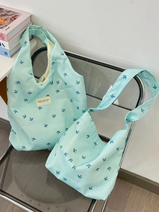 Light blue canvas tote bag set with bird print and shoulder strap for daily shopping