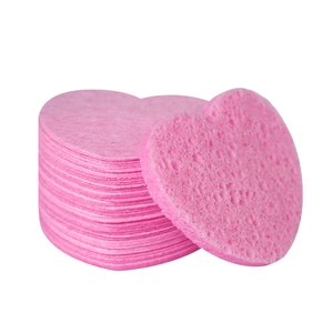 Pink heart-shaped compressed facial sponges made of natural cellulose wood pulp