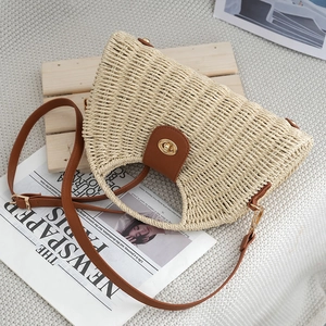 Retro semi-circle woven beach bag with brown leather strap and golden twist lock