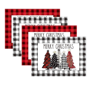 Set of 4 Christmas placemats with red and white plaid patterns and festive trees